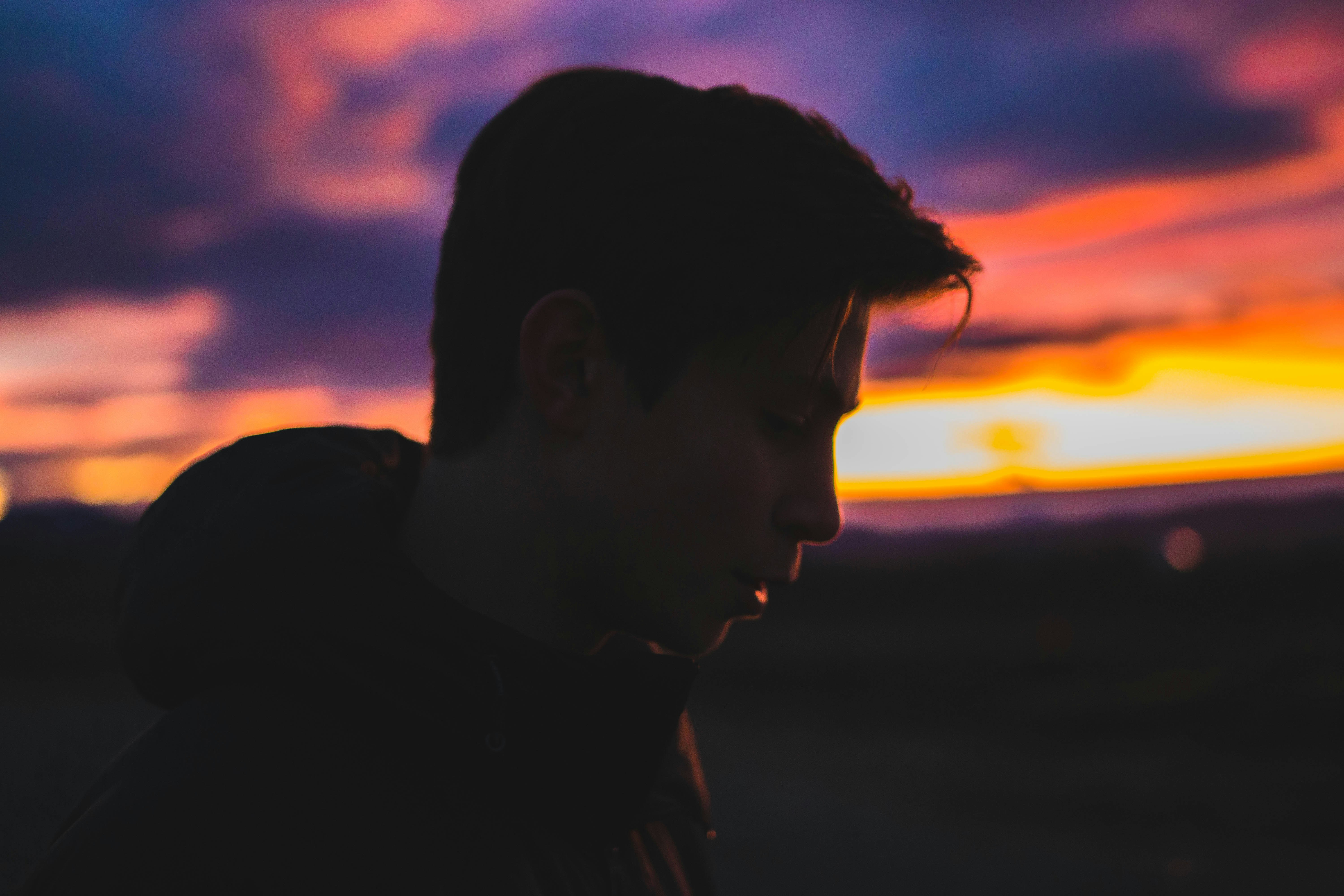 silhouette of man during sun set